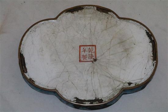 An unusual Chinese enamel on copper quatrefoil-shaped tray, Qianlong four character mark and of the period (1736-95), 18cm, damage and